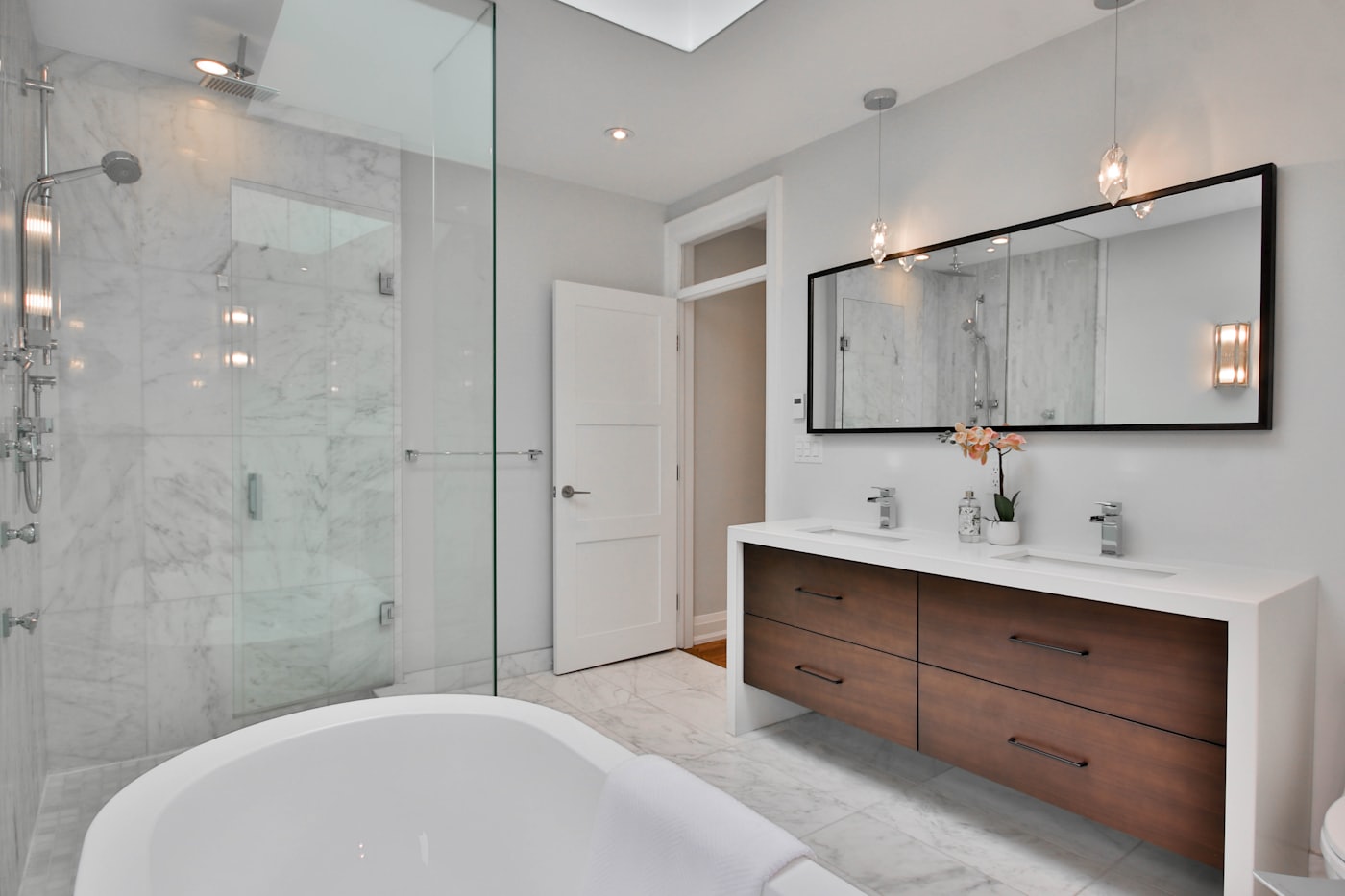 Willoughby main bathroom with a large freestanding bath beside a frameless walk-in shower.