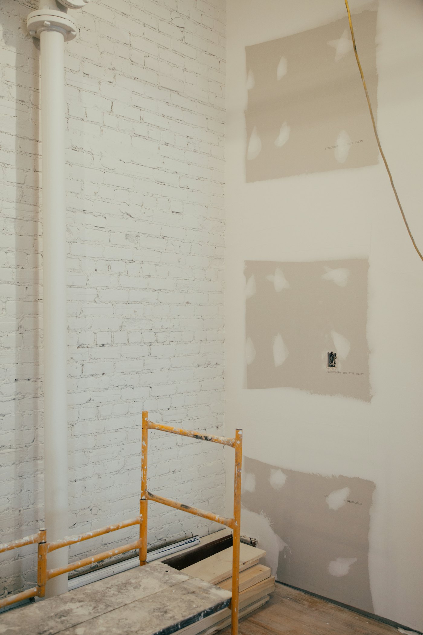 Before: the original Naremburn kitchen with dated yellow and white timber cabinetry.