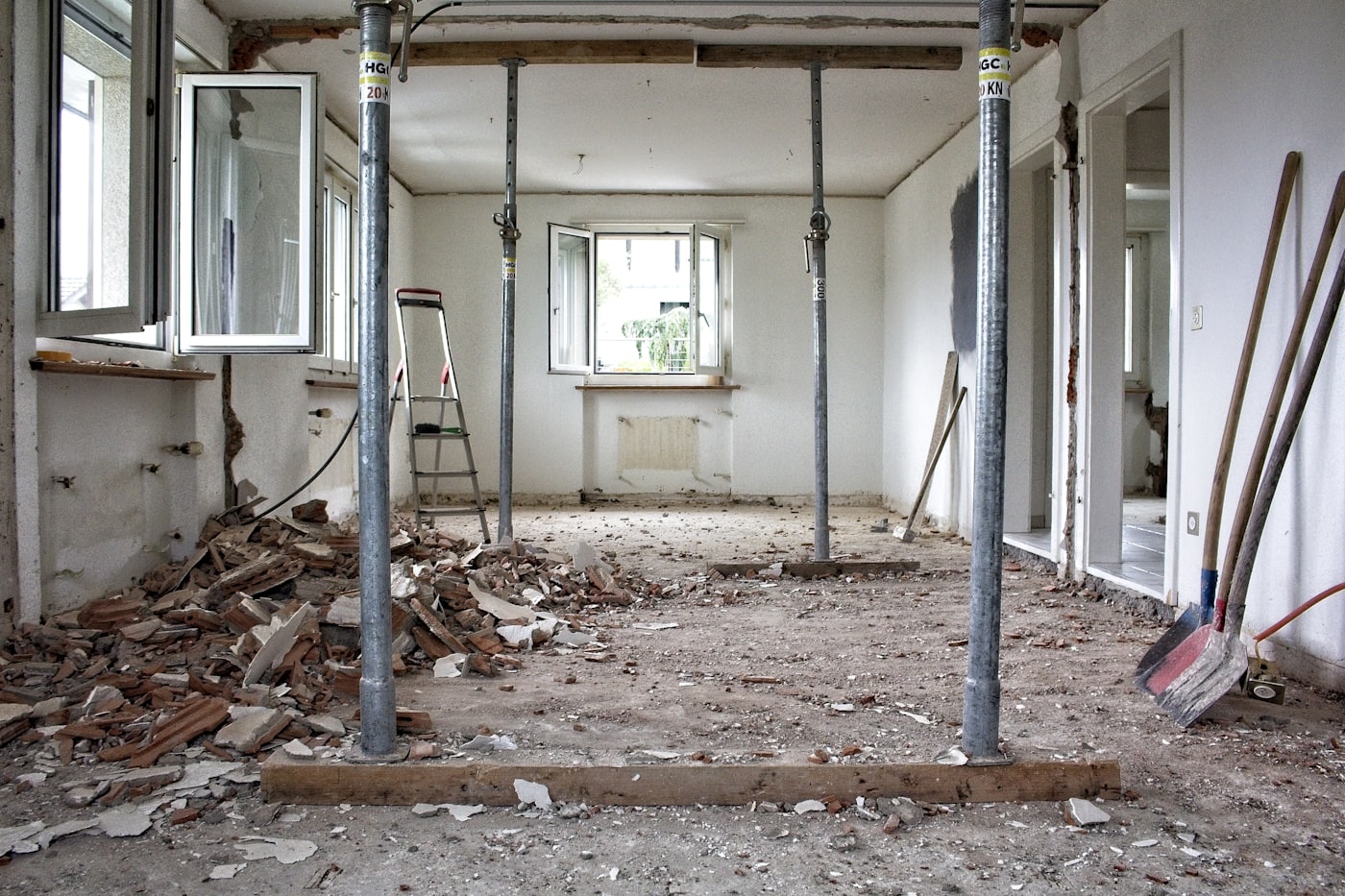 The stripped room with the team's tools laid out on the bare floor.